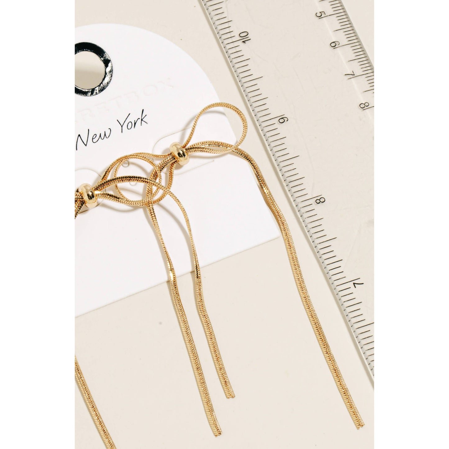 Long Metallic Ribbon Bow Stud Earrings: GD