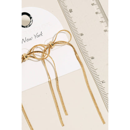 Long Metallic Ribbon Bow Stud Earrings: GD