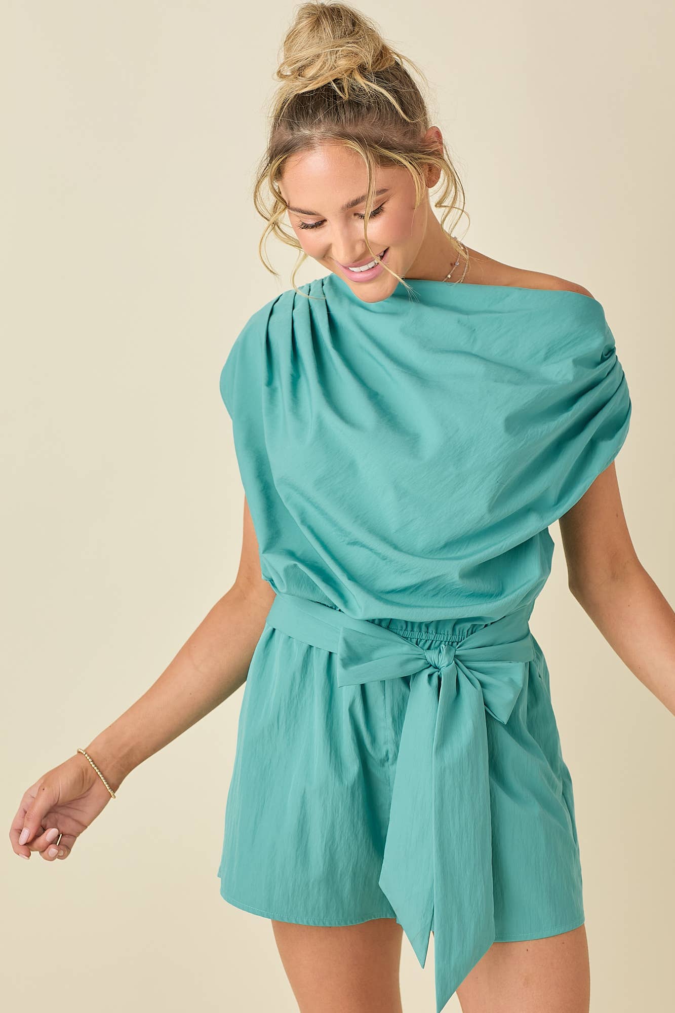 Draped unbalanced drop shoulder romper: AQUA / S